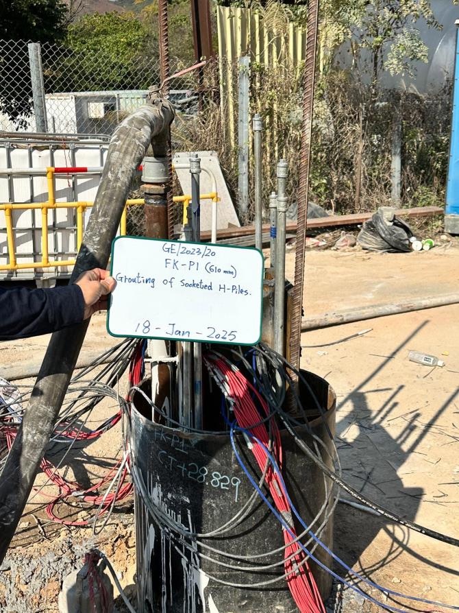 Grouting of socketed H-piles on site