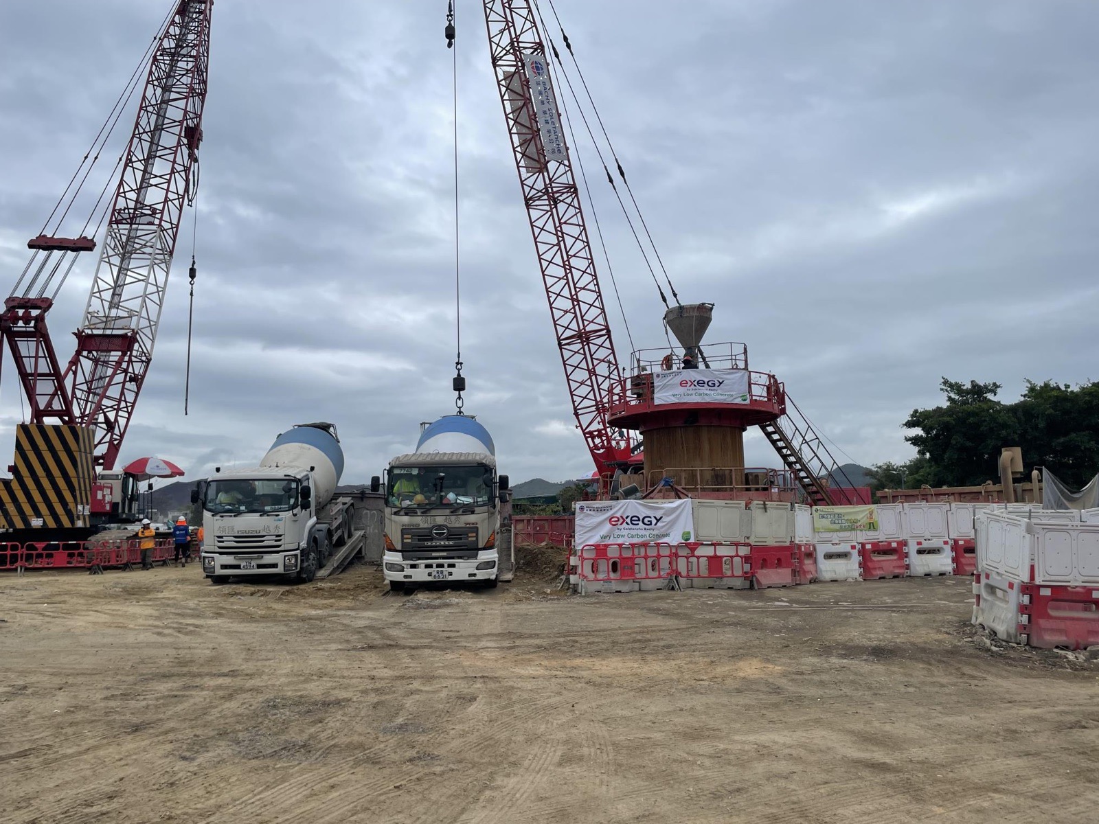 CEDD trial pile site with cranes and mixer trucks