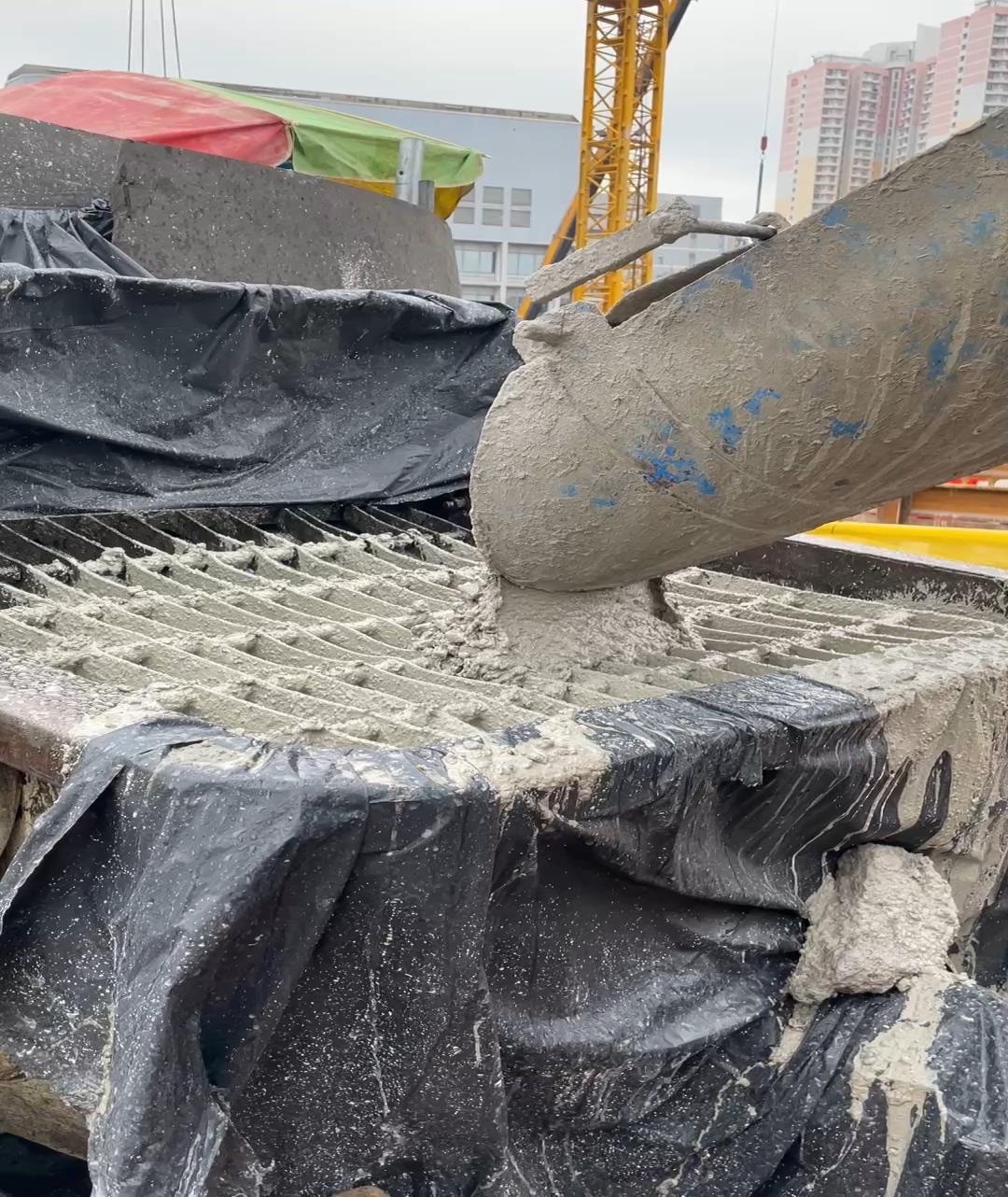 High-GGBS concrete flowing during a pile cap pour